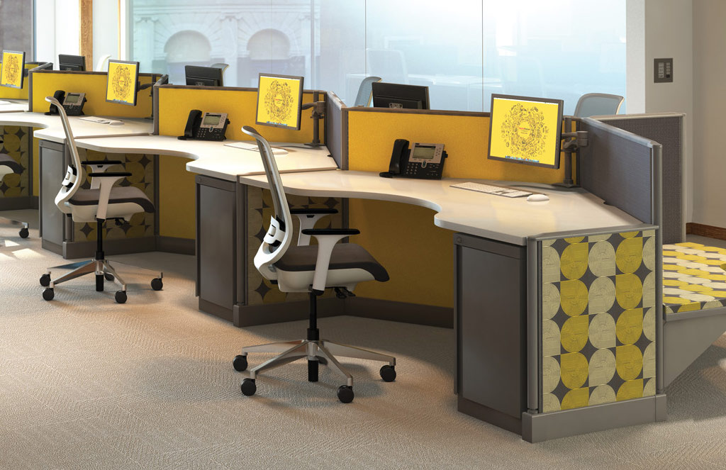 Open office workstations with ergonomic office chairs and adjustable heigh monitors