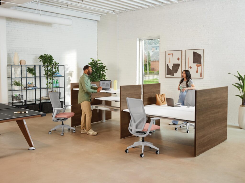 Adjustable height workstations with ergonomic office chairs.