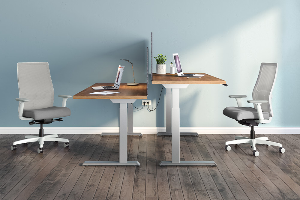 Adjustable height workstations with ergonomic office chairs