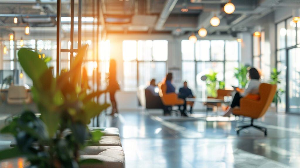 An office space with sunlight streaming through the window.