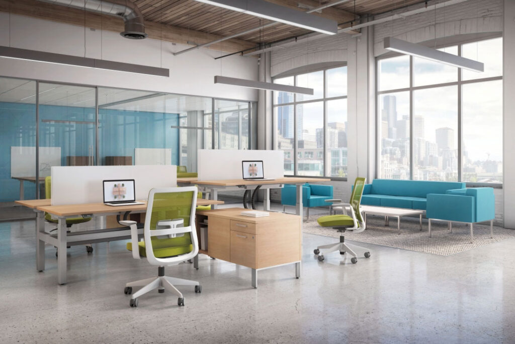 Modern office with workstations and couch.